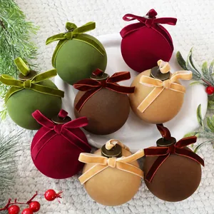 Detailed view of 8cm velvet Christmas balls with elegant matching bows for festive decor