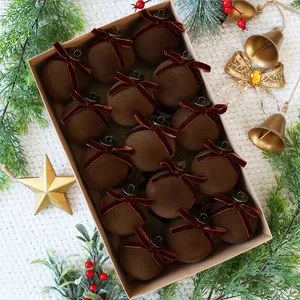 Detail of 15 brown velvet Christmas ornaments with red bows in a craft box