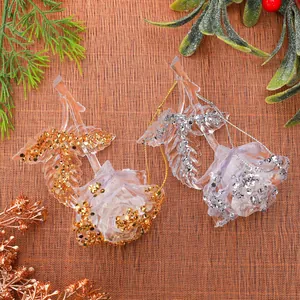 Detailed view of transparent acrylic rose ornaments with gold and silver glitter