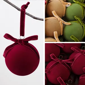 Macro view of luxurious red and gold velvet Christmas ball ornaments with bows