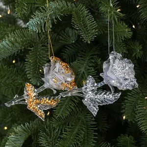 Transparent acrylic rose Christmas tree ornaments with gold and silver glitter accents.
