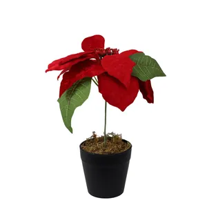Une plante de poinsettia rouge artificielle en pot noir pour la décoration de Noël