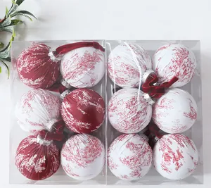 Set of elegant Christmas ball ornaments with red and white forest pattern fabric wrap
