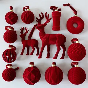 Set of 12 red flocked velvet Christmas ornaments with diverse textures and reindeer shapes