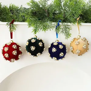 Detailed view of 8cm velvet Christmas balls with elegant pearl and rhinestone floral patterns