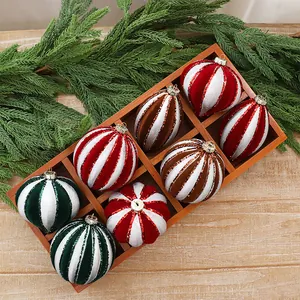 Elegant set of flocked striped Christmas ornaments in red, green, and brown festive tones