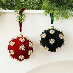 Close-up of 8cm velvet Christmas baubles with pearl flower and rhinestone decorations