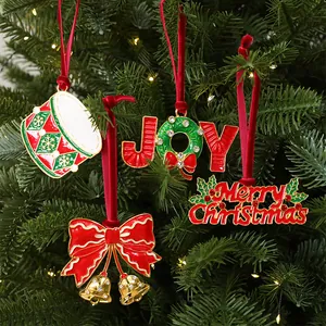 Detail view of festive alloy Christmas tree ornaments with red velvet ribbons