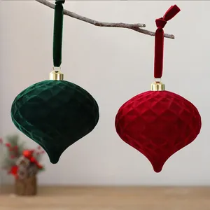 Detailed view of green and red flocked velvet diamond patterned Christmas ornaments.