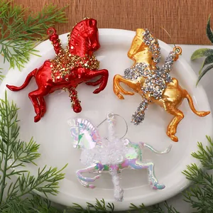 Close-up of colorful PC carousel horse Christmas tree ornaments in red, gold, and white