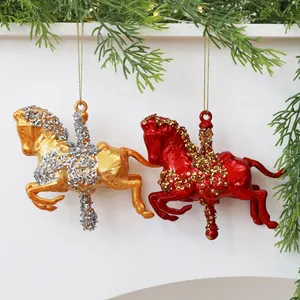 Detailed macro shot of red and gold carousel horse Christmas ornaments with sequins