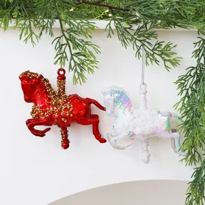 Pair of red and white carousel horse ornaments for festive Christmas tree decoration.