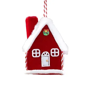 Red plush house Christmas tree ornament with white fuzzy trim and small wreath detail