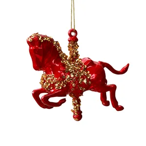 Red carousel horse Christmas ornament with gold sequin details for holiday tree decoration