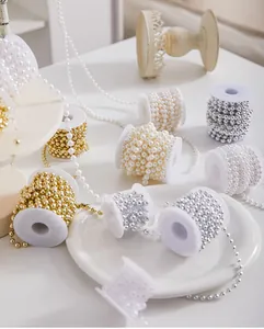Detailed view showing assorted colorful pearl bead chains in gold, silver, and cream