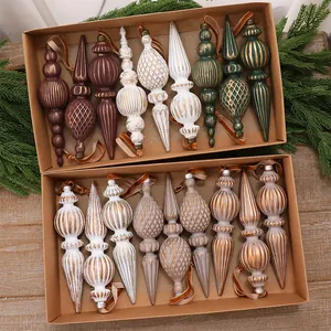 Detailed view of vintage spindle-shaped Christmas ornaments in elegant gift boxes.