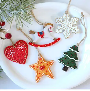 Detailed view of five vintage resin Christmas ornaments on a white plate