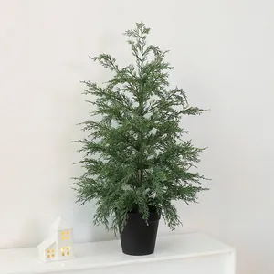Realistic 70cm artificial cypress Christmas tree in black pot for festive home decor.