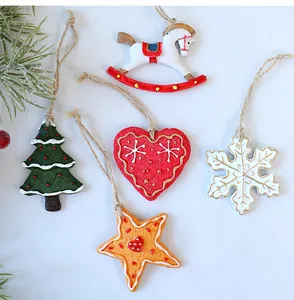 Detailed shot of retro resin Christmas ornaments featuring a snowflake, heart, and tree