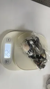 Weight measurement detail for a Halloween glowing plush gnome doll, showing 25.2g