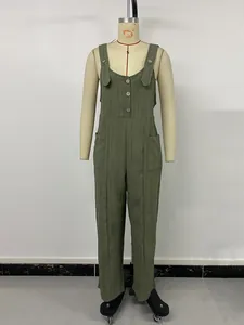 Close-up of olive green textured jumpsuit with button details and wide straps