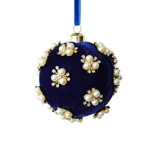Luxurious blue velvet Christmas ball ornament with pearl and rhinestone floral details