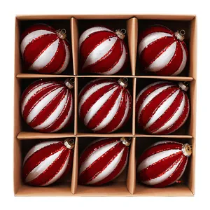 A set of 9 red and silver striped Christmas baubles with glitter details in a brown kraft gift box.