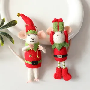 Close-up view of two needle-felted mice in festive Christmas elf outfits with soft wool texture