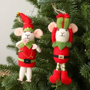 Detailed view of handmade felt wool mouse ornaments hanging on a Christmas tree