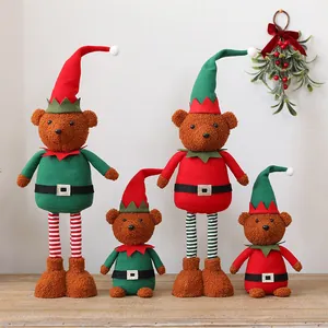 Detailed view of four Christmas telescopic plush bear dolls in festive elf costumes