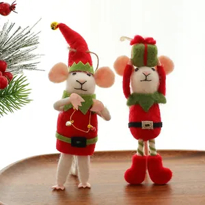Detailed macro view of handmade wool felt mouse ornaments for festive Christmas decor