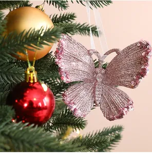 Close-up of sparkly pink butterfly Christmas tree ornament with sequin details