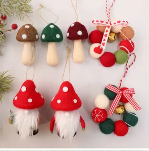 Detail of handmade felt Christmas ornaments including gnomes, mushrooms, and wreaths