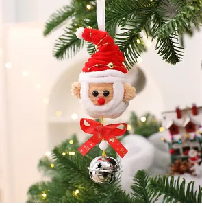 Detailed view of a handmade Santa Claus ornament featuring a red bow and silver jingle bell