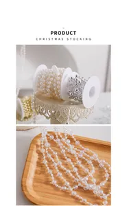 Detailed macro view of decorative Christmas bead chains on wooden and vintage displays.