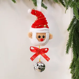 Detail of handmade plush Santa Claus Christmas ornament with ribbon and silver bell
