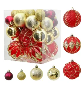 Detailed view of red and gold Christmas ball ornaments with various textures and patterns
