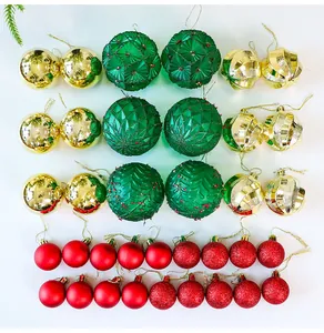 Assorted PE Christmas ball ornaments in red green and gold colors with unique textures