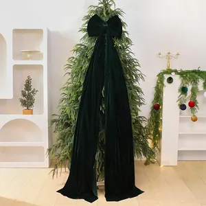 Luxurious large dark green velvet Christmas bow ornament for tree festive decoration.