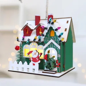 Handcrafted wooden Christmas house ornament with LED lights and festive Santa detail