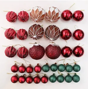 Selection of festive Christmas ball ornaments in red, green, and brown textures