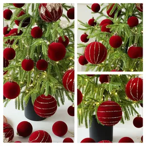 Small PE desktop Christmas tree decorated with red velvet balls and warm LED lights