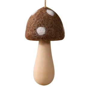 Handmade brown wool felt mushroom hanging ornament for festive Christmas tree decor