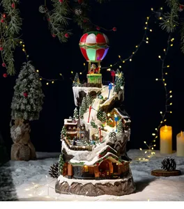Deluxe animated Christmas village snowy mountain scene with glowing LED hot air balloon
