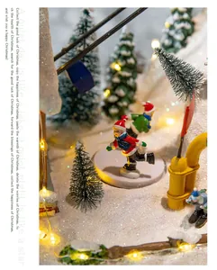 Macro detail of miniature skating figures in a glowing Christmas music box snowy scene.