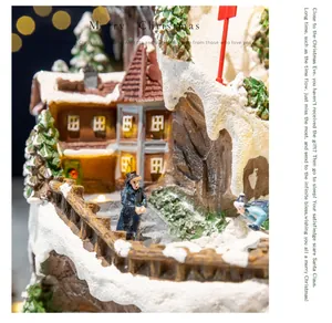Detailed macro view of a Christmas musical box featuring lighted snow village houses
