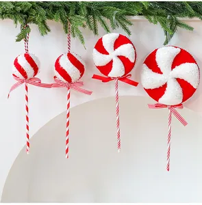 Red and white glittery Christmas candy lollipop ornaments for festive tree decor