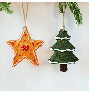 Close-up of vintage resin Christmas ornaments featuring star and tree designs with twine