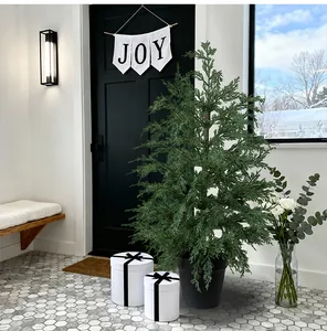 Detailed view of a realistic 90cm artificial cedar Christmas tree in a sleek black pot