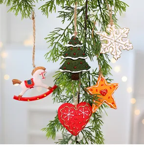 Detail view of retro resin Christmas ornaments with snowflake and star hanging on branch